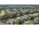 Aerial shot shows a residential area with lush greenery, tidy homes, and manicured lawns at 4432 Huddlestone Dr, Wesley Chapel, FL 33545