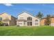 A vast backyard with a well-manicured lawn and a glimpse of the home's architecture at 4432 Huddlestone Dr, Wesley Chapel, FL 33545