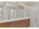 Bathroom featuring a double sink vanity, and a glass door shower at 4432 Huddlestone Dr, Wesley Chapel, FL 33545