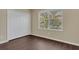 Bright bedroom featuring a closet and large window offering plenty of natural light at 4432 Huddlestone Dr, Wesley Chapel, FL 33545