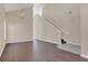 Inviting entryway with hardwood floors, staircase and a chandelier, leading to the upper level at 4432 Huddlestone Dr, Wesley Chapel, FL 33545