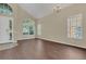 Open concept entryway with high ceilings, new floors, and large windows, offering lots of natural light at 4432 Huddlestone Dr, Wesley Chapel, FL 33545