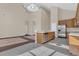 Open-concept kitchen with stainless steel appliances, ample cabinetry, connecting to a spacious living area at 4432 Huddlestone Dr, Wesley Chapel, FL 33545