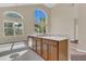 Open kitchen features ample counter space, eat in nook and a stainless steel dishwasher at 4432 Huddlestone Dr, Wesley Chapel, FL 33545