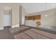 Open-concept kitchen flowing into the living space, featuring stainless steel appliances and plenty of counter space at 4432 Huddlestone Dr, Wesley Chapel, FL 33545
