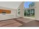 Bright living room, open concept, with stainless steel appliances, natural light and wood floors at 4432 Huddlestone Dr, Wesley Chapel, FL 33545