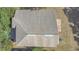 Aerial view of a light-colored roof with rectangular skylights and gray shingles at 4432 Huddlestone Dr, Wesley Chapel, FL 33545