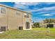 The townhome boasts a spacious backyard with lush green grass and a private patio area at 4722 67Th N Ave, Pinellas Park, FL 33781