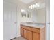 Bathroom with double sink vanity with a large mirror and cabinet storage at 4722 67Th N Ave, Pinellas Park, FL 33781