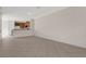 Spacious open-concept living space with neutral tile and a view into the kitchen area at 4722 67Th N Ave, Pinellas Park, FL 33781