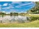 Scenic pond with clear water and lush greenery under a vibrant sky at 4722 67Th N Ave, Pinellas Park, FL 33781