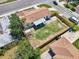 Aerial view of a home showcasing a large fenced backyard, patio, and proximity to local streets at 7824 Starkey Rd, Seminole, FL 33777