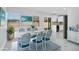 Bright dining area featuring white marble floors, decor art, and seating for six at 7824 Starkey Rd, Seminole, FL 33777