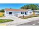 Charming single-story home with a fenced front yard and well-maintained landscaping at 7824 Starkey Rd, Seminole, FL 33777