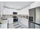 Modern kitchen with stainless steel appliances, ample cabinet space, and sleek countertops at 7824 Starkey Rd, Seminole, FL 33777