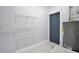 Storage area with shelving, access door, and mechanical equipment at 7824 Starkey Rd, Seminole, FL 33777
