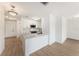 Modern white kitchen with stainless steel appliances, laminate floors and quartz countertops at 11901 4Th N St # 2107, St Petersburg, FL 33716