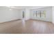 Bright living room with laminate floors, large windows and a door leading to a balcony at 11901 4Th N St # 2107, St Petersburg, FL 33716