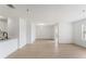 Spacious open-plan area with laminate floors, white walls, and a combined living, dining, and kitchen area at 11901 4Th N St # 2107, St Petersburg, FL 33716