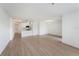 Spacious open-plan area with laminate floors, white walls, and a combined living, dining, and kitchen area at 11901 4Th N St # 2107, St Petersburg, FL 33716