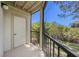This screened-in patio features a door and views of lush greenery at 11901 4Th N St # 2107, St Petersburg, FL 33716