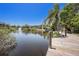 Scenic view of a pond with a fountain, surrounded by lush greenery and buildings at 11901 4Th N St # 2107, St Petersburg, FL 33716