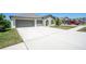 Lovely single-story house with a spacious driveway and neat landscaping at 11910 Field Thistle Ct, Riverview, FL 33579