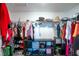 Organized walk-in closet offering ample storage with shelving, hanging rods, and space for shoes and accessories at 11910 Field Thistle Ct, Riverview, FL 33579
