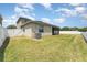 Large backyard featuring a well-maintained lawn and privacy fence at 13188 Royal Pines Ave, Riverview, FL 33579