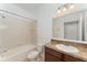 Bathroom featuring a bathtub, toilet, and granite countertop vanity at 13188 Royal Pines Ave, Riverview, FL 33579