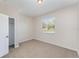 Bright bedroom featuring a window, carpet, and closet at 13188 Royal Pines Ave, Riverview, FL 33579