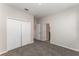 This bedroom offers neutral walls, carpet, and a double door closet at 13188 Royal Pines Ave, Riverview, FL 33579
