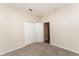 Bedroom featuring neutral walls, carpet, and a double door closet at 13188 Royal Pines Ave, Riverview, FL 33579