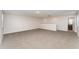 Spacious bonus room featuring neutral carpeting and a bright, open layout, perfect for versatile living at 13188 Royal Pines Ave, Riverview, FL 33579
