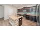 Stylish kitchen featuring stainless steel appliances, granite countertops, and a center island at 13188 Royal Pines Ave, Riverview, FL 33579