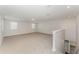 A loft area filled with natural light and featuring carpeted floors at 13188 Royal Pines Ave, Riverview, FL 33579