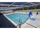 A refreshing in-ground pool with a basketball hoop, and plenty of space for entertaining at 3309 Rock Valley Dr, Holiday, FL 34691