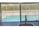 A glimpse of the outdoor pool through the kitchen window at 3309 Rock Valley Dr, Holiday, FL 34691