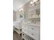 Dual sinks offer ample counter space, stylish fixtures, and wood-look flooring at 621 Erin Way, Brooksville, FL 34601