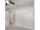 Bedroom features a ceiling fan, carpet floors and a closet that offers ample storage space at 621 Erin Way, Brooksville, FL 34601