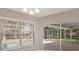 Bright dining area showcasing a view of the screened lanai and pool at 621 Erin Way, Brooksville, FL 34601