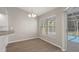 Eat-in kitchen with wood floors and views of screened in lanai and pool at 621 Erin Way, Brooksville, FL 34601
