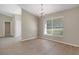 Dining room with wood floors, a chandelier, and a large window offering natural light at 621 Erin Way, Brooksville, FL 34601