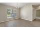 Dining room with wood floors, a chandelier, and a large window with natural light at 621 Erin Way, Brooksville, FL 34601