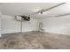 Spacious two car garage with concrete floors and utility sink at 621 Erin Way, Brooksville, FL 34601