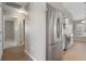 Modern kitchen featuring stainless steel appliances, wood floors, and white cabinetry at 621 Erin Way, Brooksville, FL 34601