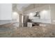 Updated kitchen features stainless steel appliances, granite counters, and modern white cabinets at 621 Erin Way, Brooksville, FL 34601