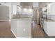 Bright, modern kitchen with granite countertops, island seating, and stainless steel appliances at 621 Erin Way, Brooksville, FL 34601