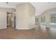 Spacious living room featuring wood floors, neutral walls, and access to the pool area at 621 Erin Way, Brooksville, FL 34601