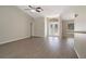 Bright and airy living room featuring tile flooring and a ceiling fan at 621 Erin Way, Brooksville, FL 34601